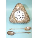 A silver embossed pocket watch holder of triangular form, Birmingham 1898, 11.5 x 11.5cm, (holes