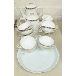 Sixteen pieces of Royal Crown Derby 'Kedleston' teaware and a ceramic cake stand decorated with
