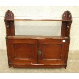 An Edwardian mahogany small two-door wall cupboard fitted with a shelf, 61cm wide, 57cm high.