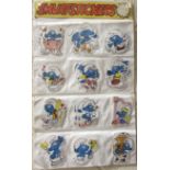 A collection of Smurf stickers by Peyo, in original shop display pocket, 57 x 35cm, (approximately