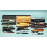 A collection of four modern fountain pens, propelling pencils, ballpoint pens and miscellaneous