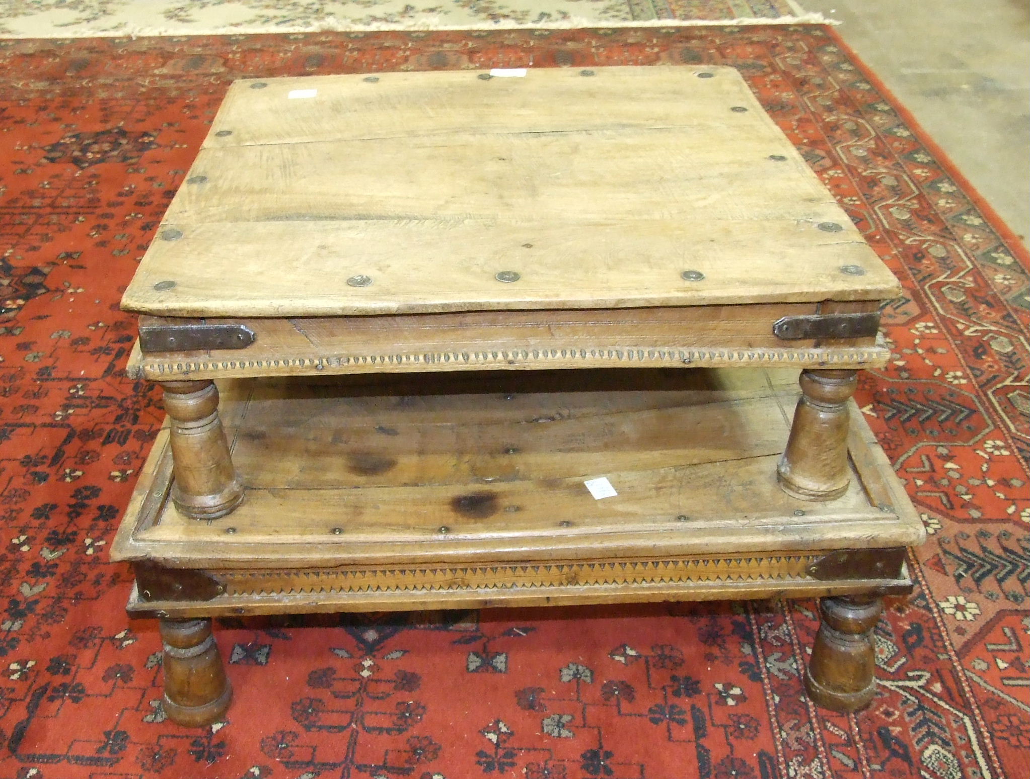 Two Eastern metal-bound hardwood low coffee tables, each on turned legs, 64 x 63cm and 57 x 56cm, (