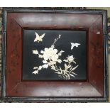 A Japanese mother-of-pearl and bone panel decorated with flowers and birds, 20.5 x 26.5cm, in
