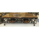 A copper hot plate/food warmer, with two burners and trays, on wrought iron stand with brass and