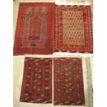 A late-20th century Oriental prayer mat, 150 x 93cm and three other small Oriental rugs, (4).