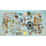 A quantity of costume jewellery brooches.