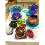 A collection of studio and other coloured glass ware including a pale blue frill basket with amber