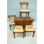 Four Victorian mahogany dining chairs, the curved top rails on turned legs and an antique mahogany