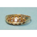 A small gold gypsy ring set 8/8-cut diamonds, (tested as 18ct gold, approximately), size P, 2g.