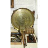 A brass Benares tray on folding wooden stand, 57cm diameter, a wooden truncheon and other wood and