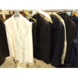 A collection of formal wear including black and white dinner jackets and two top coats, size