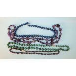 A necklace of graduated malachite beads and three other hardstone bead necklaces, (4).
