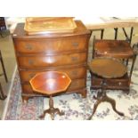 A reproduction mahogany bow-fronted chest of four drawers, 76cm wide, a Swiss music table, a