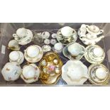 A Coalport Ming Rose miniature tea set, other miniature cups and saucers, two coloured glass