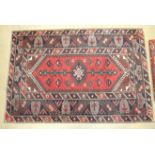 A late 20th century oriental rug, 190 x 120cm and two smaller rugs, (3).
