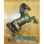 After Farbel, Rearing Horse, a bronzed metal sculpture, signed on rectangular base, 34cm high.