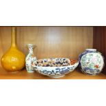 An oval Chinese Imari shallow bowl, 26cm diameter, a small famille decorated baluster vase with wavy