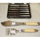 A pair of short plated candlesticks, a cased set of six silver-handled tea knives and other plated
