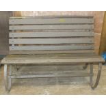 An iron-framed slatted wooden railway-style bench, 120cm wide and a folding painted teak bench,