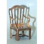 A miniature silver carver chair impressed Longfellow 1807-1882, maker L&S, Birmingham 1935, 5cm