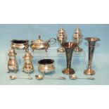 A silver three-piece cruet with blue glass liners, Birmingham 1920, other silver cruets, small spill