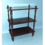 A Victorian mahogany three-tier whatnot on turned legs with castors, 73cm wide, 96cm high, a