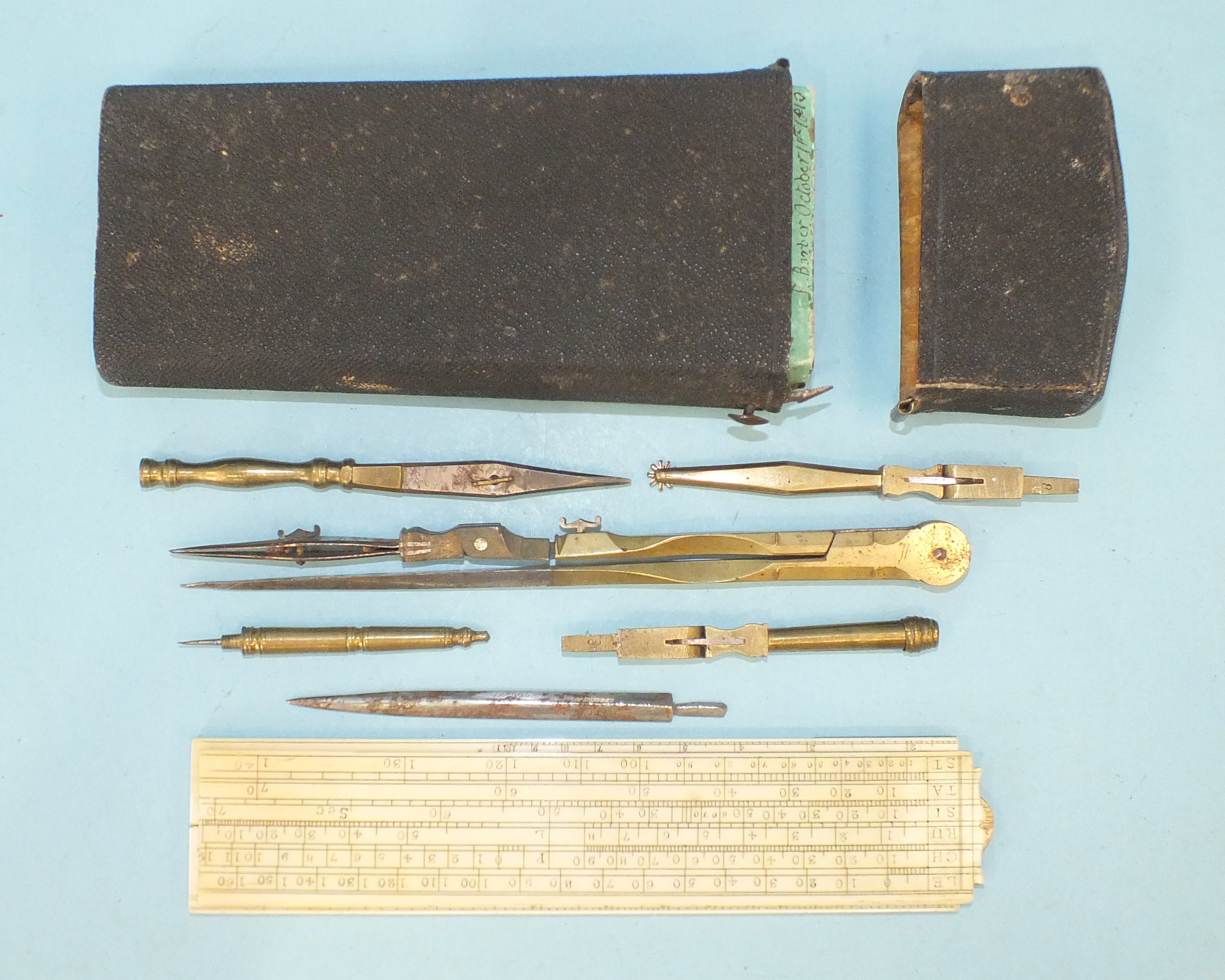 An early-19th century instrument set in fitted shagreen case, containing ivory scale rule, a folding