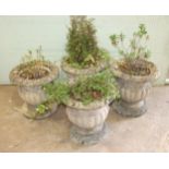 A set of four cast concrete planters of bulbous gadrooned form, 42cm high, (4).