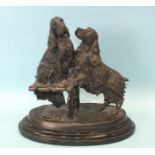 After Barrie, a bronzed metal sculpture of two Cocker Spaniels, one seated on the remnants of a
