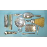 An early-20th century silver-backed dressing table set and manicure set, including circular hand
