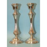 A pair of modern silver candlesticks with loaded circular bases, makers Broadway & Co, Birmingham