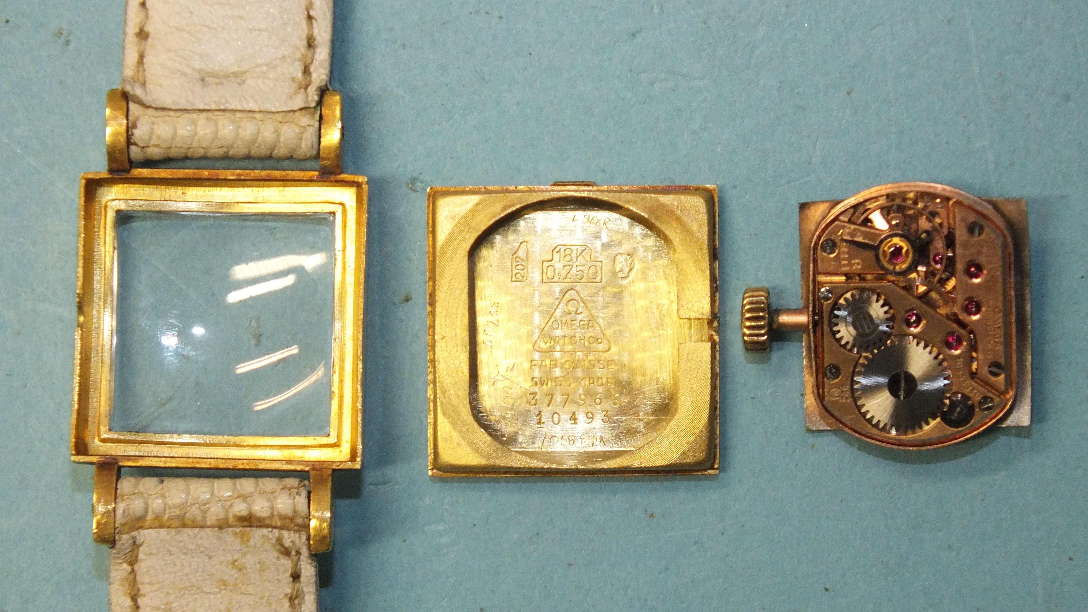 Omega, a lady's late-1950's 18ct gold-cased wrist watch, the square silvered dial with baton - Image 2 of 3