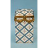 A Limoges ceramic box of oblong form, with gilt metal mounts, painted with roses and blue lattice