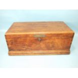 A camphor wood chest with hinged lid and flush carrying handles, bearing brass name plate W Howard-