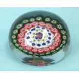 A Baccarat glass millefiori paperweight, 4.5cm high.