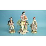 An early-19th century Derby porcelain figure of a seated gentleman playing pipes, 18cm high and a