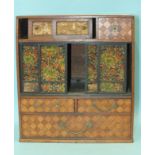 A walnut and parquetry Oriental jewellery cabinet, the rectangular top above two slides, a drawer,