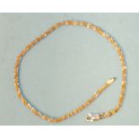 An 18ct yellow and white gold fancy link bracelet, 19.5cm, 4g.