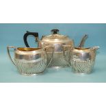 A silver three-piece tea service of half-gadrooned oval form, maker Charles Boyton II, London 1897-