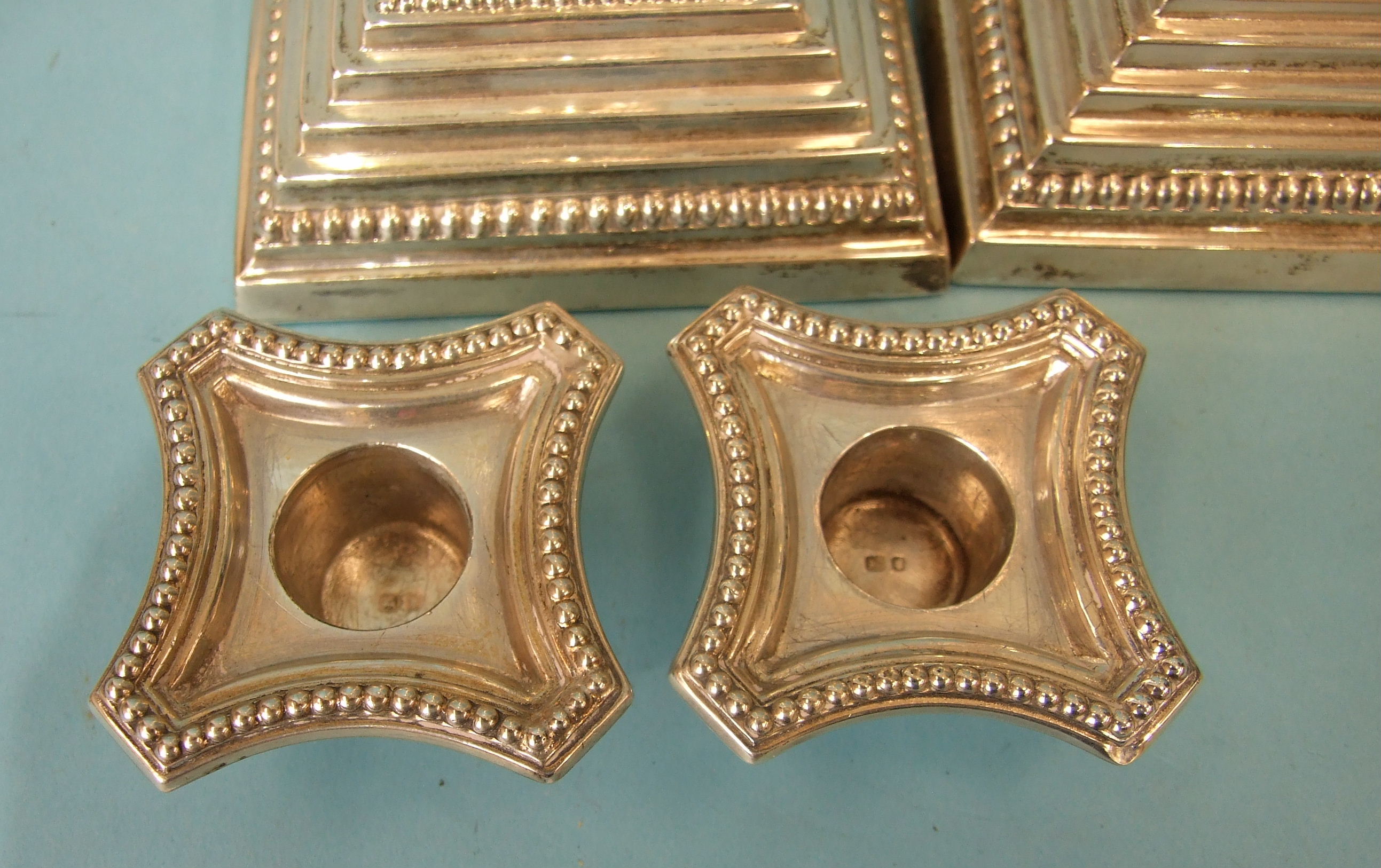 A pair of loaded silver Corinthian column candlesticks on stepped and beaded square bases, with drip - Image 4 of 5