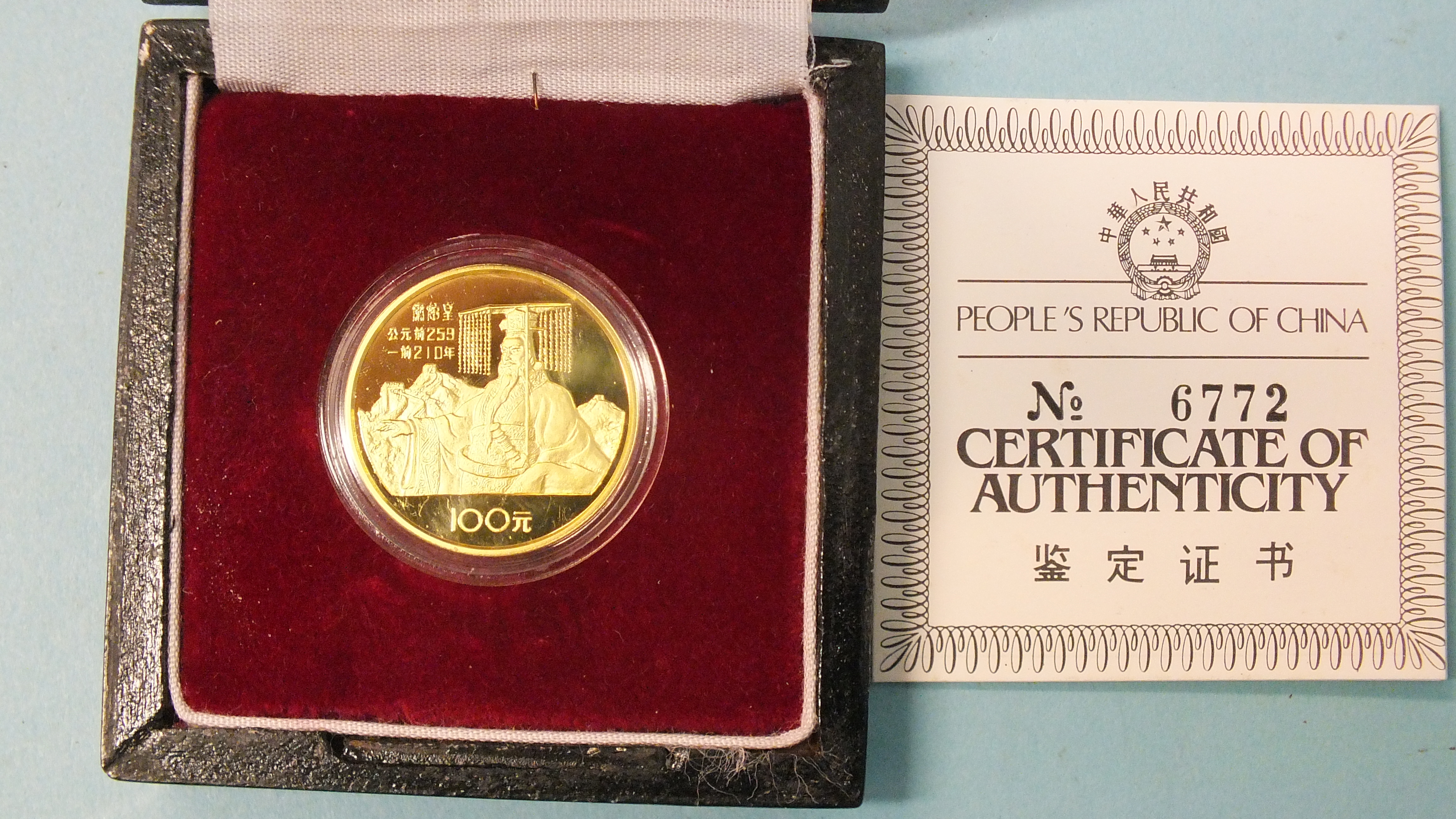 China, a cased 1984 gold proof 100-yuan coin in capsule, with certificate of authenticity.