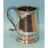 A George III Newcastle silver tankard of baluster form, on circular foot, with scroll handle,
