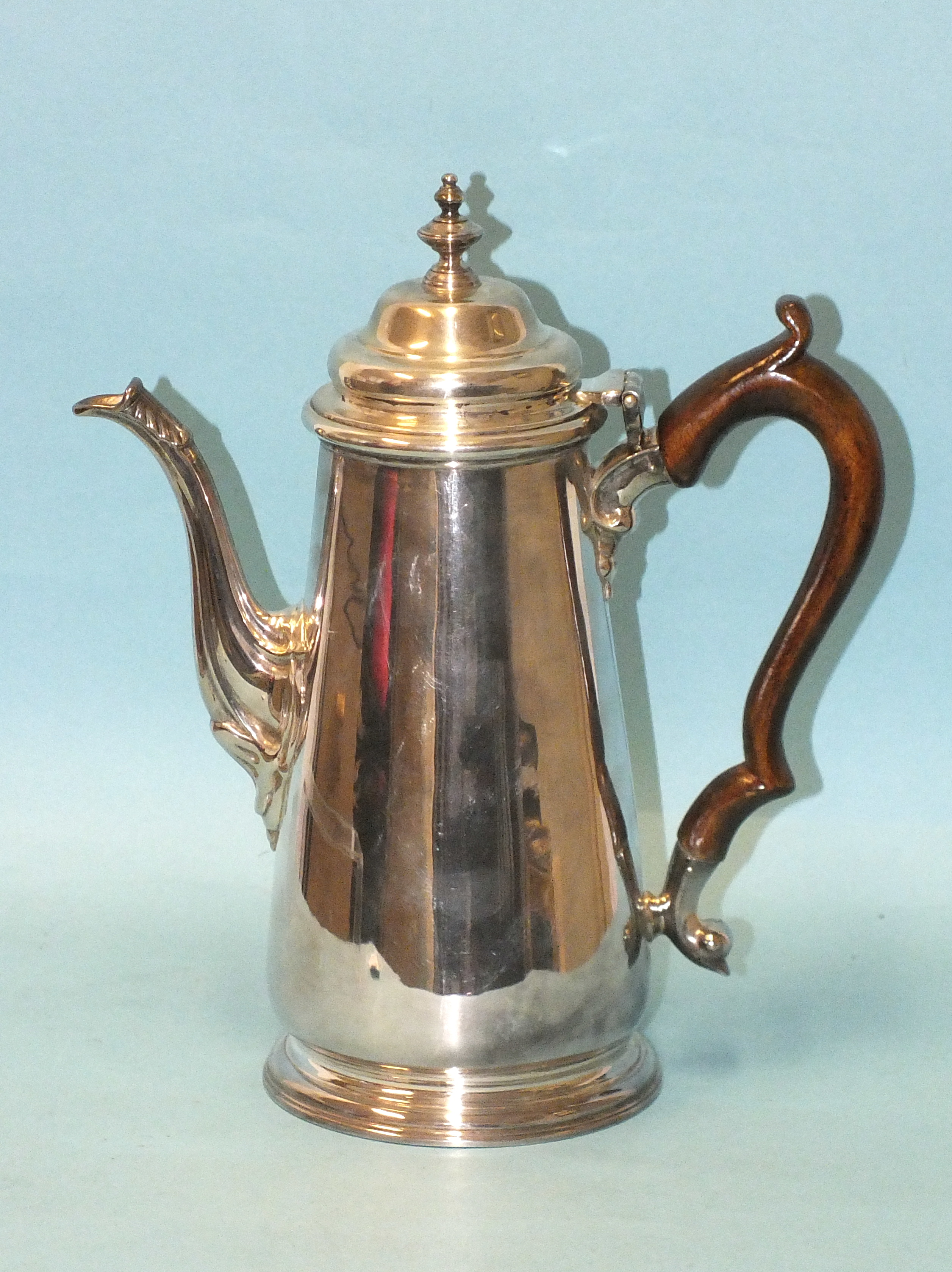 A modern Georgian-style silver coffee pot of tapered form, with fruitwood scroll handle, maker