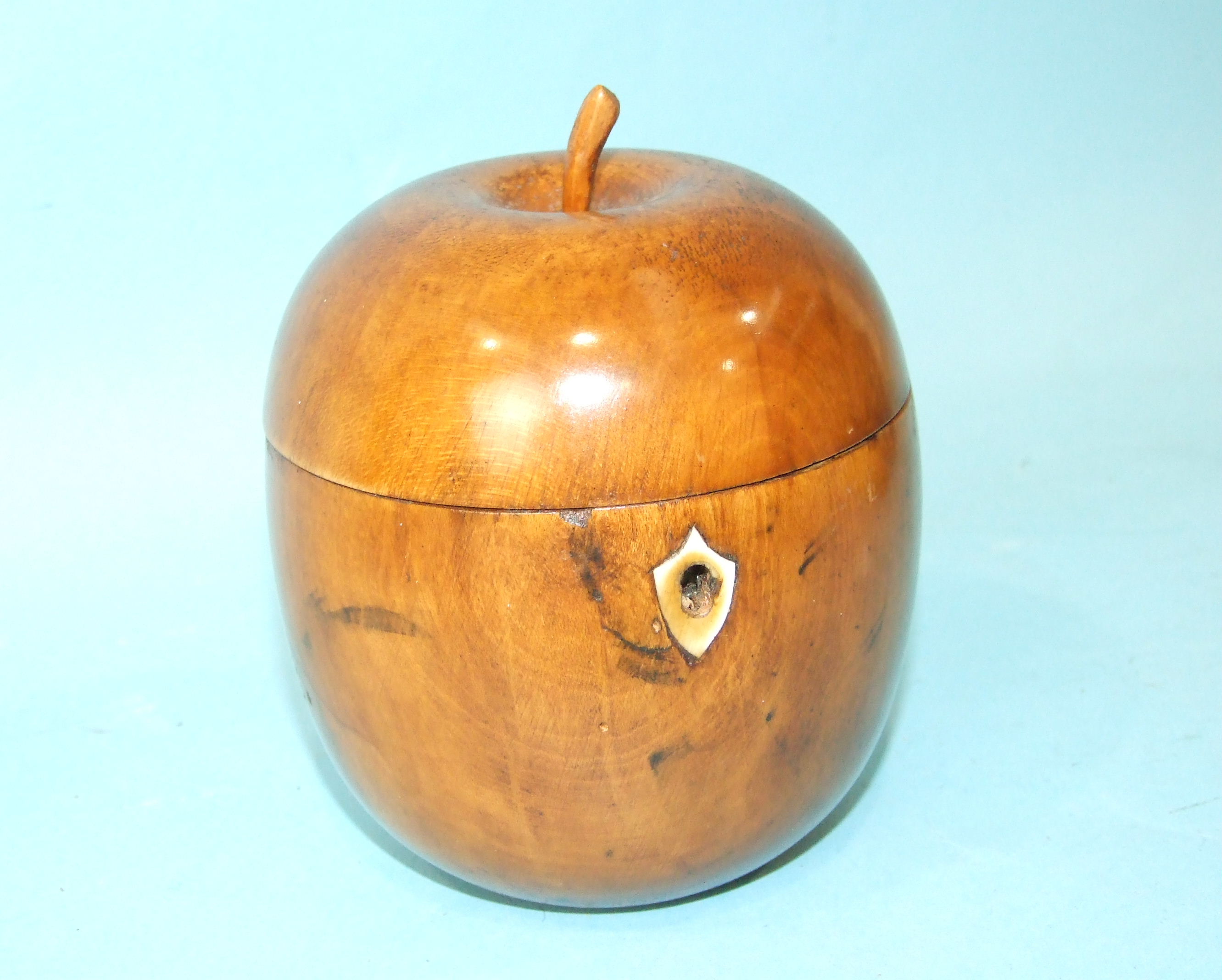 A 19th century tea caddy in the form of an apple, with later foil lining, 14cm high, (repair to