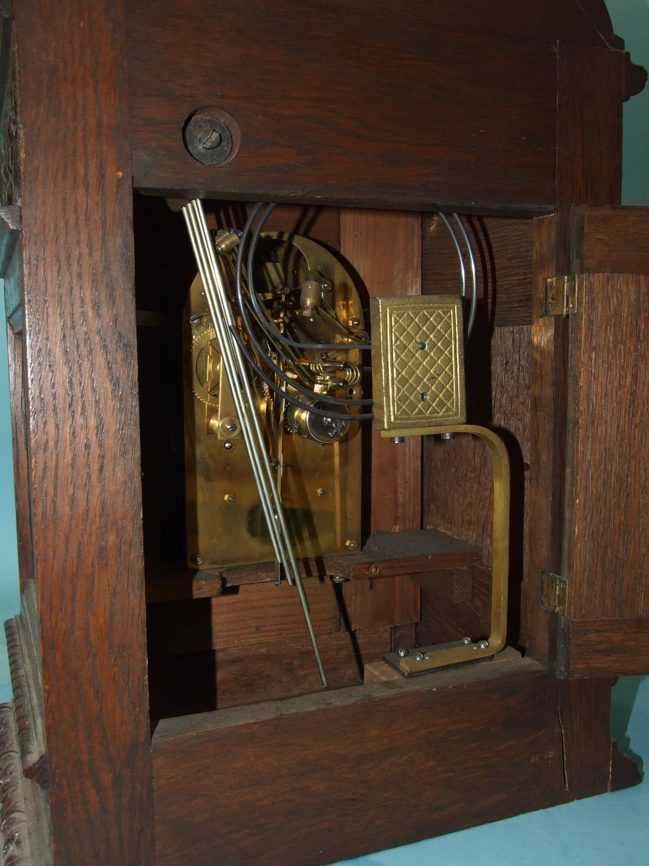 An Edwardian carved oak bracket clock, the arched gilt brass dial with silvered chapter ring, slow/ - Image 2 of 3