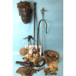 A collection of mid-20th century African woven baskets, a finger harp, carved wood mask and
