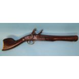 A 19th century Turkish flintlock blunderbuss pistol, the 29cm flared barrel with walnut full stock