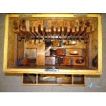 A well-presented collection of various wooden woodworking planes, including eighteen moulding
