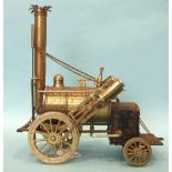 A model of Stephenson's Rocket, of cast metal and tinplate construction, (some surface corrosion),