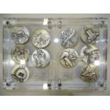 A set of ten silver Salvador Dali's 'The Ten Commandments' medals, each medal 5cm diameter, with